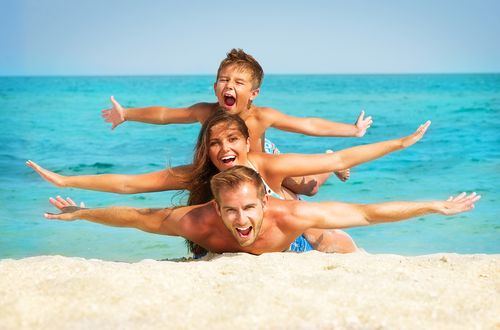 family-playing-on-the-beach